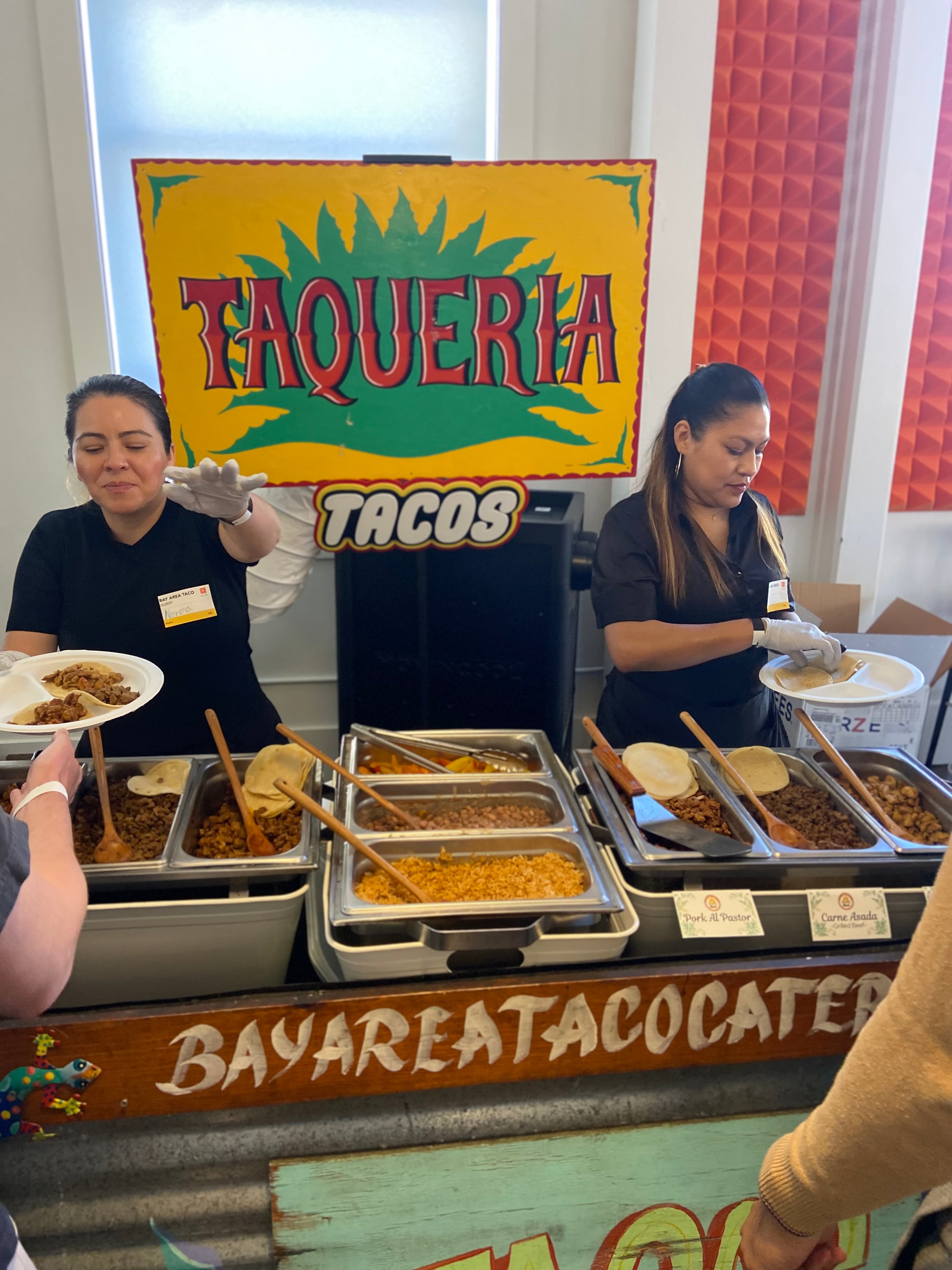 Chef cooking at a live-action taco station at an event