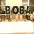 Boba bar setup with dispensers and toppings