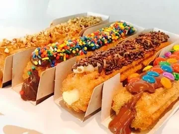Churro bar with assorted toppings and sauces